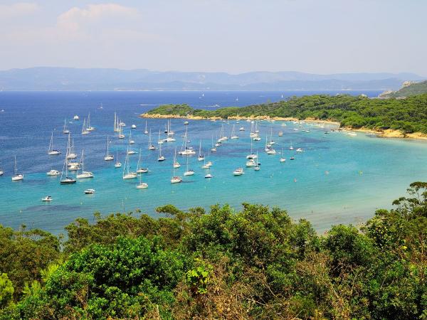 Yachts anchored in a bay on the island of Porquerolles in the south of France