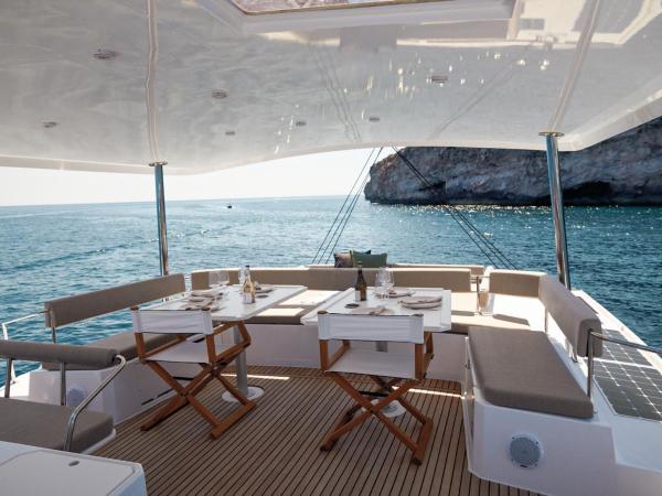 Outside dining area on Bali 5.4 catamaran cabin charter in Italy