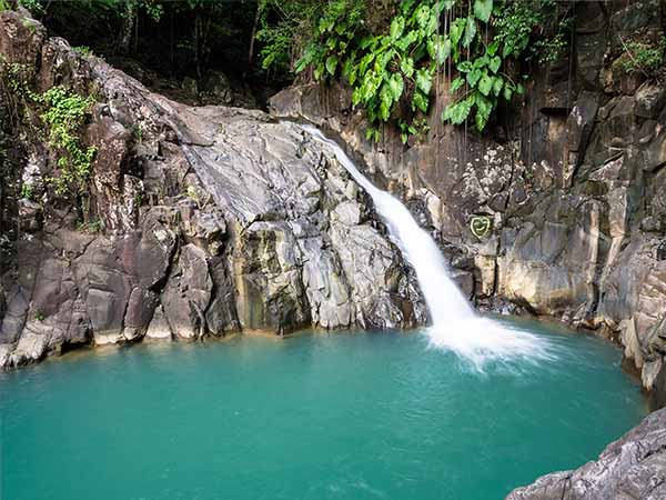 turquoise pool with waterfall 