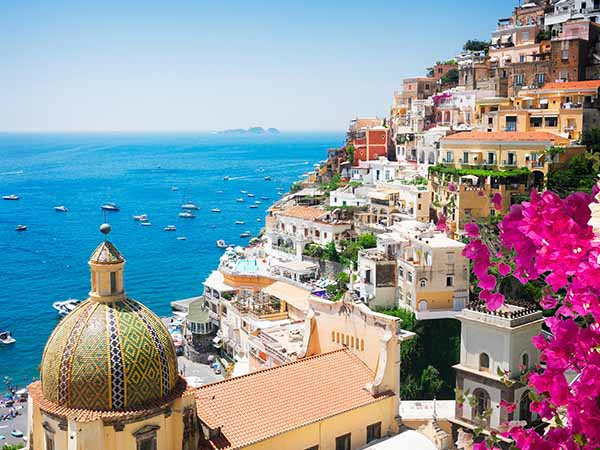 view of Positano with flowers - famous old italian resort, Italy