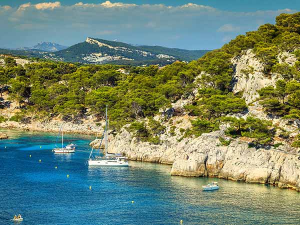 Amazing Calanque De Port Pin bay with sailing boats and luxury yachts, Calanques National Park near Cassis fishing village, Provence, South France, Europe