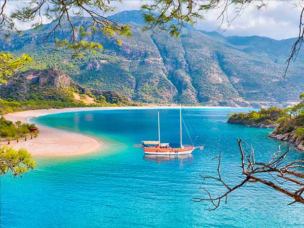 Brown gulet anchored at the Aegean sea - Panoramic view of Oludeniz Beach And Blue Lagoon, Oludeniz beach is best beaches in Turkey - Fethiye, Turkey